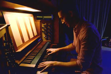 Sam Ritter, senior music major, plays the organ for a skit performed at the annual Focus Show. - Photo by Ebbie Davis