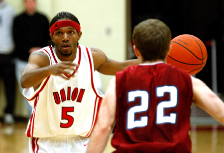 Freshman guard Marcus Cooper (5) prepares for his next move in the Bulldog win over Lyon College. - Photo by Jonathan Blair
