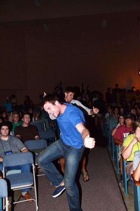 John Dawson, senior social work major, dances down the aisle during the Focus Show. - Photo by Zac Calvert
