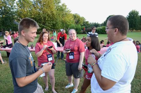 Freshmen Tim Zornes, Emma Barnett, Madi Hanks, Chamara Hamiliton-Corley and Cedric Townsend talk together during the annual ice cream social at the home of David and Lanese Dockery. - Photo by Jacob Moore