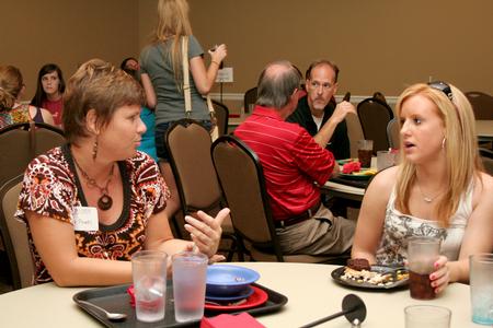 Julie Powell, associate professor of sport management, talks with Casie Logan, freshman pews major, during Dinner with your Department in the Carl Grant Event Center. - Photo by Deanna Santangelo