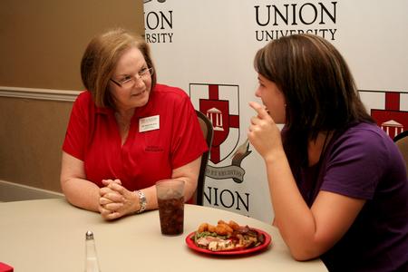 Ann Singleton, associate dean of education, talks with Allie Fuqua, freshman special education major, during Dinner with your Department in the Carl Grant Event Center. - Photo by Deanna Santangelo