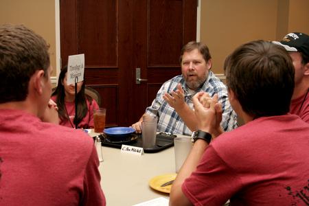 Ben Mitchell, Graves professor of moral philosophy, talks with new students during Dinner with your Department in the Carl Grant Event Center. - Photo by Deanna Santangelo