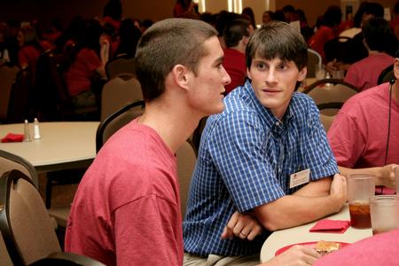 Georg Pingen, assistant professor of engineering, talks with Casey Withers, freshman engineering major, during Dinner with your Department in the Carl Grant Event Center. - Photo by Deanna Santangelo