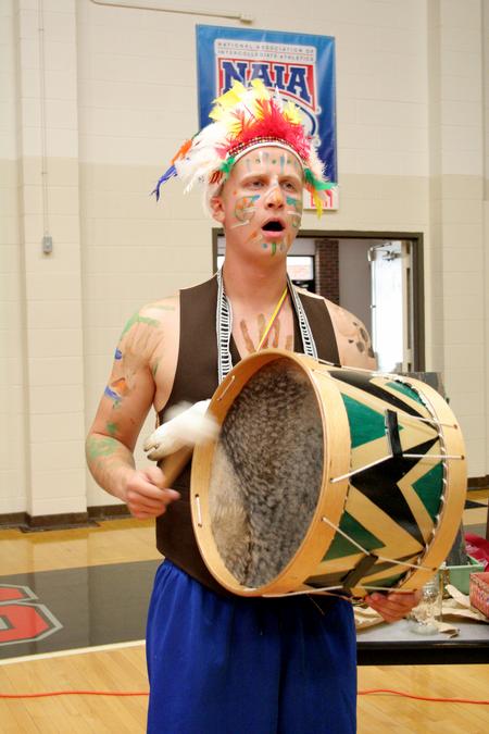 Ben Wright, sophomore dms major, bangs on a drum during the LifeGroup presentations for new students.  - Photo by Deanna Santangelo