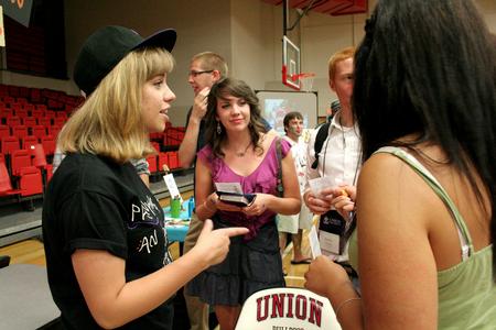 Madelyn Carson, sophomore music major, talks with students during the LifeGroup presentations in the Fred DeLay Gymnasium.  - Photo by Deanna Santangelo