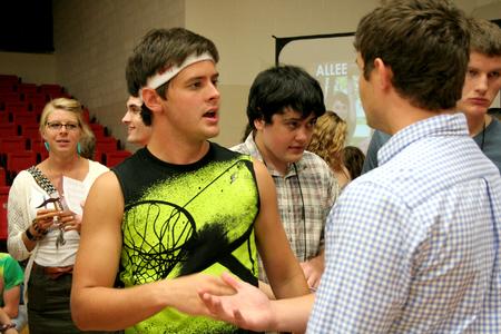 Jeremy Isbell, junior music major, talks with Caleb Thompson, freshman biblical studies major, during the LifeGroup presentations in the Fred DeLay Gymnasium.  - Photo by Deanna Santangelo