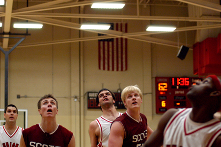 (L to R in white uniforms) Union's Bruno Martinessi, Ben Frederick, and Zack Wiggs react to a shot attempt against the Lyon College Scots. - Photo by Jonathan Blair