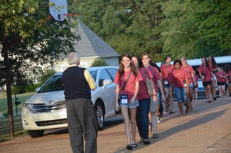 Students are greeted by David S. Dockery, president of the university, as they arrive for the annual ice cream social hosted by the Dockerys. More than 350 students attended the event.  - Photo by Morris Abernathy