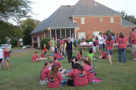 David S. Dockery, president of the university, greets new students at the ice cream social held at his home. - Photo by Morris Abernathy