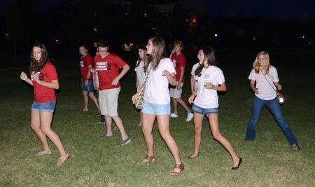 Students practice a country line-dance on the Great Lawn during the Howdy Party. - Photo by Jacob Moore