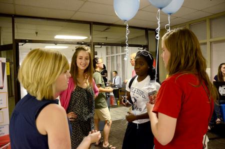 New students mingle at the Student Activity Fair held in the Penick Academic Center, allowing the new students to get involved with campus life.  - Photo by Ebbie Davis