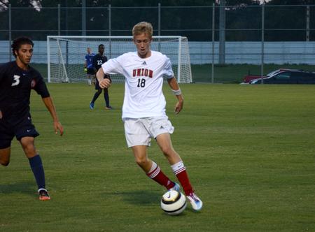 Alex Pratt dribbles down the field in his first Union varsity game. Union University men's soccer team opened off the season with a win over Wallace State Community College, 4-1. 
 - Photo by Ebbie Davis