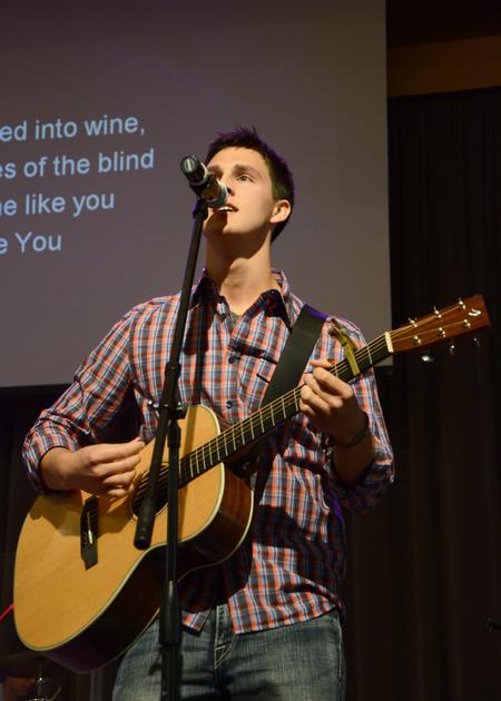 Brett Perkins, senior Christian studies major, leads music during chapel. - Photo by Jacob Moore