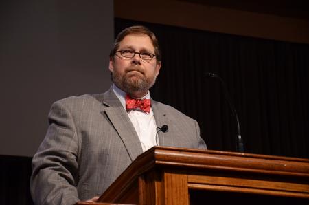 Ben Mitchell, Graves professor of moral philosophy, pauses during chapel to remember the people who were killed in the Sept. 11, 2001 attacks and how they were unprepared to die.   - Photo by Zac Calvert