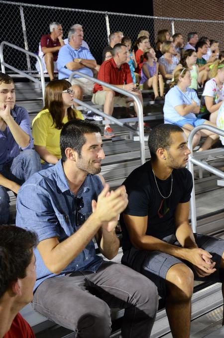 Dani Marti, junior international business major, and Pedro Faller, freshman business administration major, cheer on the men's soccer team as they play Notre Dame College. - Photo by Zac Calvert