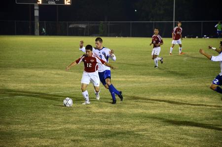 Daniel Decker fights to keep control of the ball during a game against Notre Dome College.  - Photo by Zac Calvert