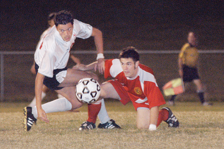 Marko Pavlovic (#20) plays with intensity against a Lyon defender. Union defeated Lyon College (Ark.), 4-0, during LIFE Group night.  - Photo by Jonathan Blair