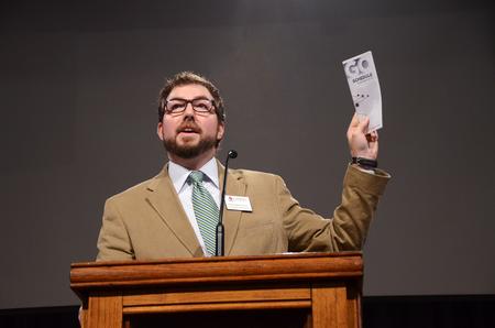 Taylor Worley, associate dean for spiritual life, talks about the importance of GO week during chapel and introduces the chapel speaker. - Photo by Zac Calvert