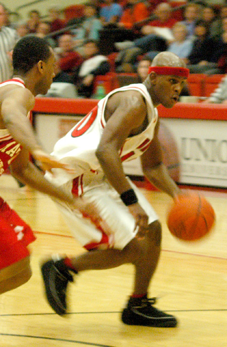 Senior guard Zach Wiggs (40) drives to the basket during Union's game with Martin Methodist. - Photo by Courtney Ross