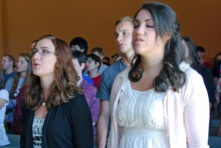 Sophomores Kelsey McFarland and Rachel Robbins worship with the Union community during chapel. - Photo by Anne Richoux