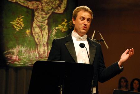 Chris Mathews, associate professor of music and department chair, welcomes the audience to the music department's presentation of "Sounding through the Centuries" during the KJV400 festival: Legacy and Impact. - Photo by Anne Richoux