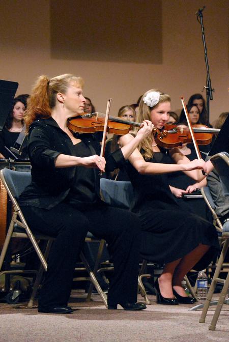 Violinists Tricia Wilburn (left) and Anna Frederick perform during the music department's "Sounding through the Centuries" concert, a part of the KJV400 Festival: Legacy and Impact. - Photo by Anne Richoux