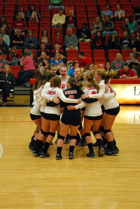The Lady Bulldogs volleyball team gathers mid-court prior to a game against Lyon College to get ready for the match.  - Photo by Anne Richoux