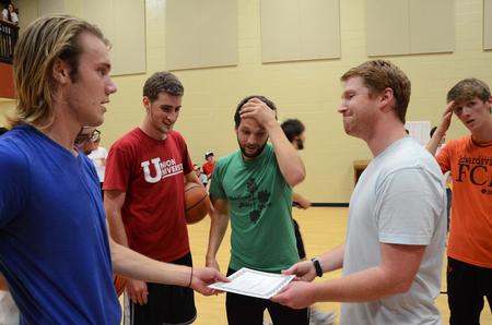 Jo Dresser, Kyle Gallop, Jay Griffith, and Cameron Puckett are presented with the award for winning the 7th annual Residence Life Treasure Hunt by Luke Pruett, residence director. - Photo by Zac Calvert