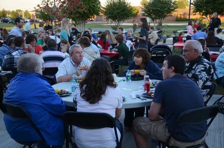 Families eat outside of the Bowld Student Commons at the Make-a-wish cookout for Family Weekend.  - Photo by Zac Calvert