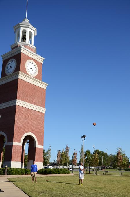 Jason Kriaski, junior Biblical studies major, and Matt Buckett, freshman biology major, practice flag football on the Great Lawn.  - Photo by Zac Calvert