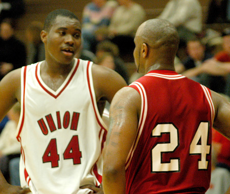 Freshman center Pierry Valmeria (44) talks with a Martin Methodist RedHawk during Union's 68-65 overtime win. - Photo by Courtney Ross