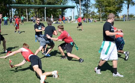 Students play a a game of intramural flag football on Family Weekend. - Photo by Jacob Moore