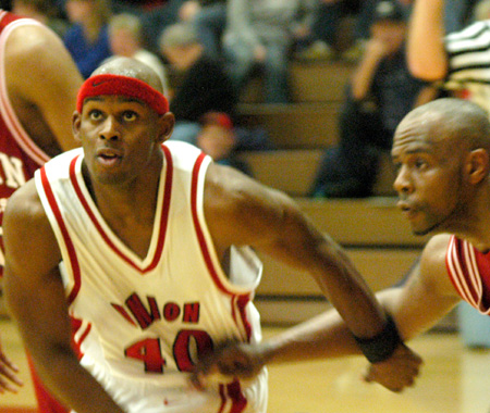 Senior guard Zack Wiggs (40) goes for a rebound during a free throw attempt. - Photo by Courtney Ross