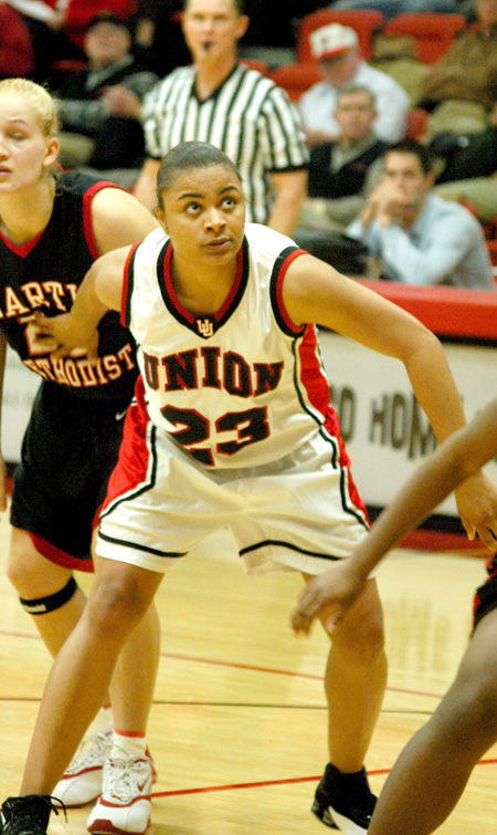 Sophomore forward Christina Smith (23) blocks out a defender during a free throw attempt. - Photo by Steven Aldridge