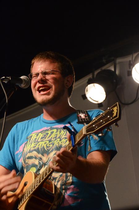 Kyle Dwyer, sophomore youth ministry major, sings at Open Mic in Barefoots Joe. - Photo by Zac Calvert
