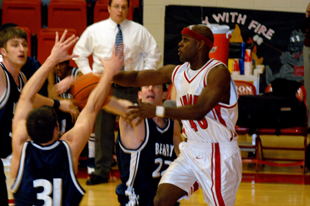 Senior guard Zach Wiggs (40) attempts a pass through traffic during Union's win over Berry College. - Photo by Jonathan Blair
