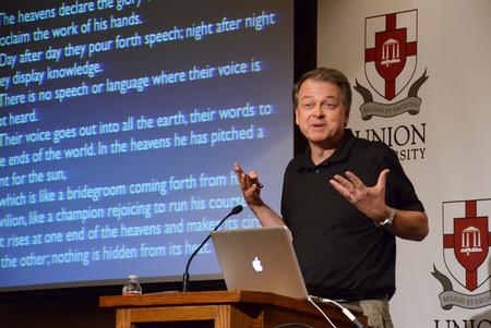 Jeffrey Hardin, professor and chair of the department of zoology at University of Wisconsin-Madison, speaks on "Glory in Fascination" to members of the Pew Research program. - Photo by Jacob Moore