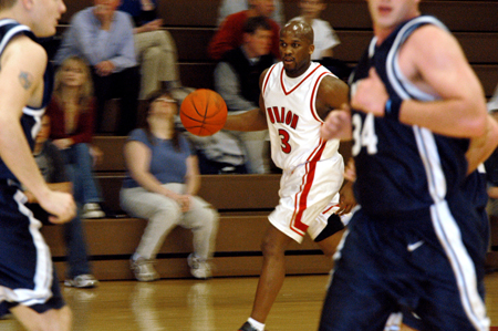 Senior guard Chima Abakwue (3) brings the ball up the floor against Berry College. - Photo by Jonathan Blair