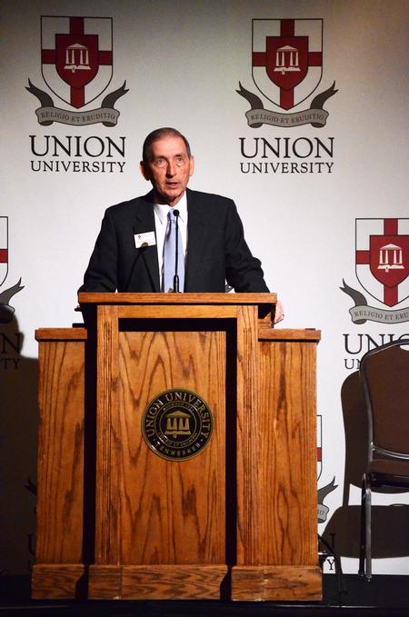 Thomas Rosebrough, executive dean of the college of education and human studies, introduces the film "Race to Nowhere" about the problems with education in America.  The film was shown by the School of Education.   - Photo by Zac Calvert