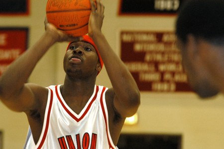 Freshman center Pierry Valmeria eyes his target during a free throw attempt. - Photo by Jonathan Blair