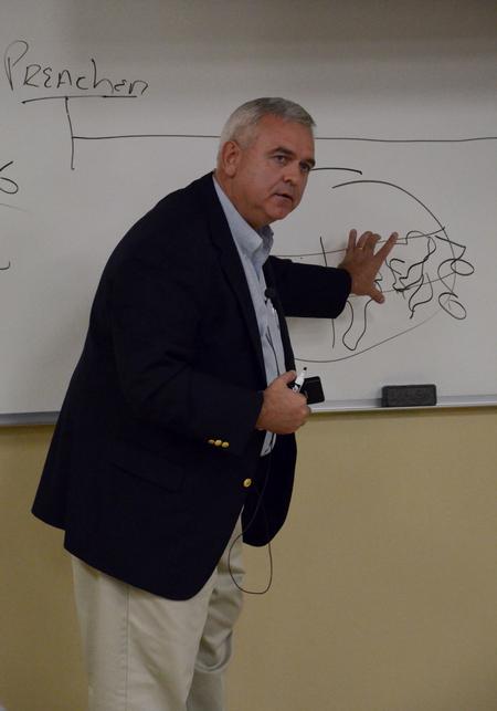 Patrick Melancon, managing director of disaster response and training for Baptist Global Response, speaks during the "Culture and Crisis" Town and Gown lecture series. - Photo by Anne Richoux