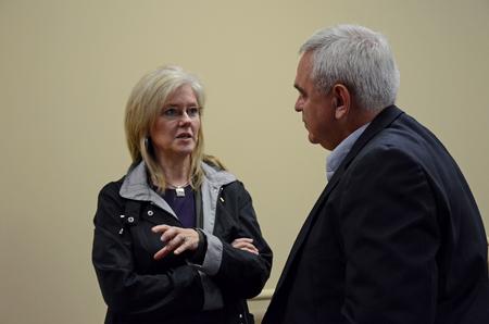 Patrick Melancon, managing director of disaster response and training for Baptist Global Response, talks with Sherri Buntain (left), senior sociology major, following his lecture at the Town and Gown lecture series.  - Photo by Anne Richoux