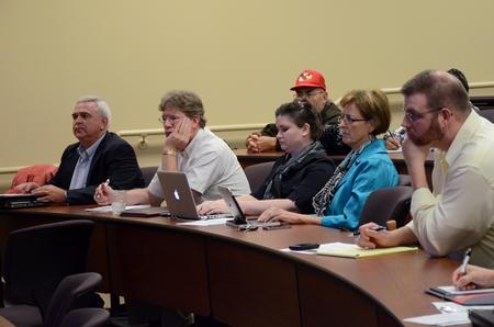Guests listen as Melody Harper speaks during the "Culture and Crisis" Town and Gown lecture series.  - Photo by Anne Richoux