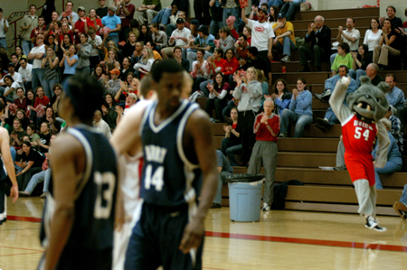 Union students, along with <i>Buster</i>, cheer on the Bulldogs in their win over Berry. - Photo by Jonathan Blair