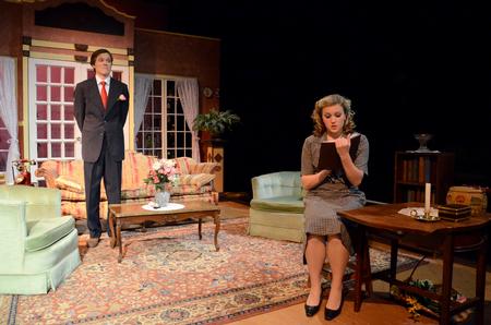 Peter Riggs, sophomore philosophy major, looks on as Savannah Trevelen, freshman theater major, reads out of her diary in the theater program's production of "The Importance on Being Earnest." - Photo by Anne Richoux