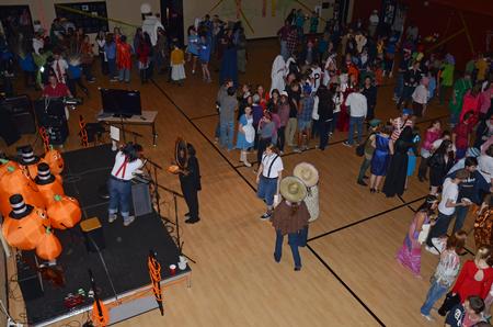 Students enjoy the festivities at Costume Coffee House, an annual event hosted by Residence Life.  - Photo by Anne Richoux