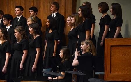 Mikayla Wagner, senior psychology major, plays the flute during the annual Fall Choral Concert. - Photo by Jacob Moore