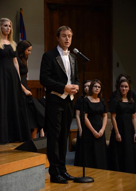 Chris Matthews, associate professor of music and department chair, introduces a song during the annual Fall Choral Concert. - Photo by Jacob Moore