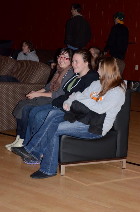 Yongjoo Jo, freshman elementary education major, Alexa MacKay, freshman Christian ministry and missions major, and Amanda Kuenzle, freshman nursing major, talk prior to the movie in the Bowld Student Commons sponsored by the Student Government Association.  - Photo by Anne Richoux